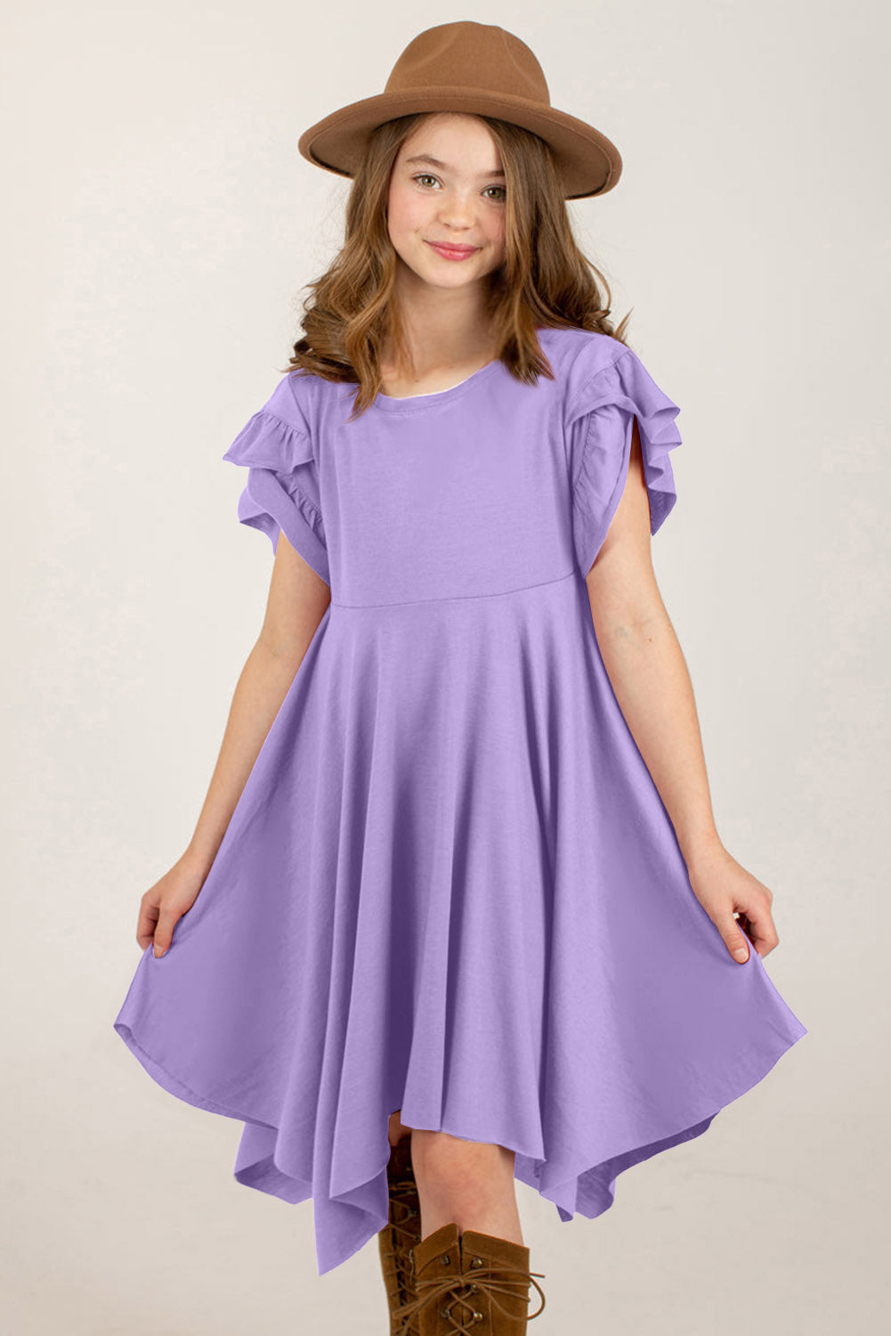 Chic round neck dress with petal sleeves in lavender on a smiling girl wearing a brown hat.